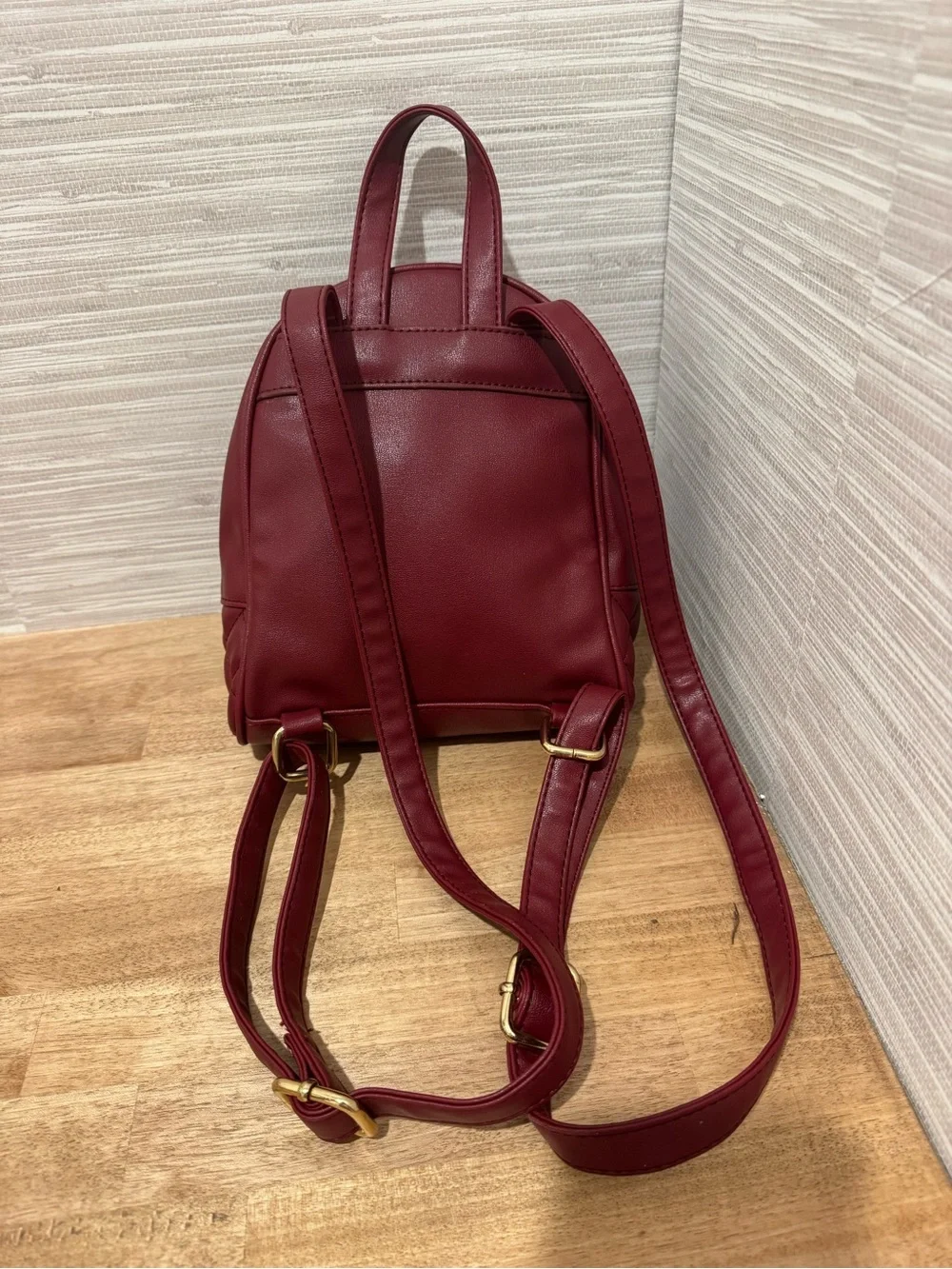 bebe Small Quilted Backpack in Burgundy with Gold Chain